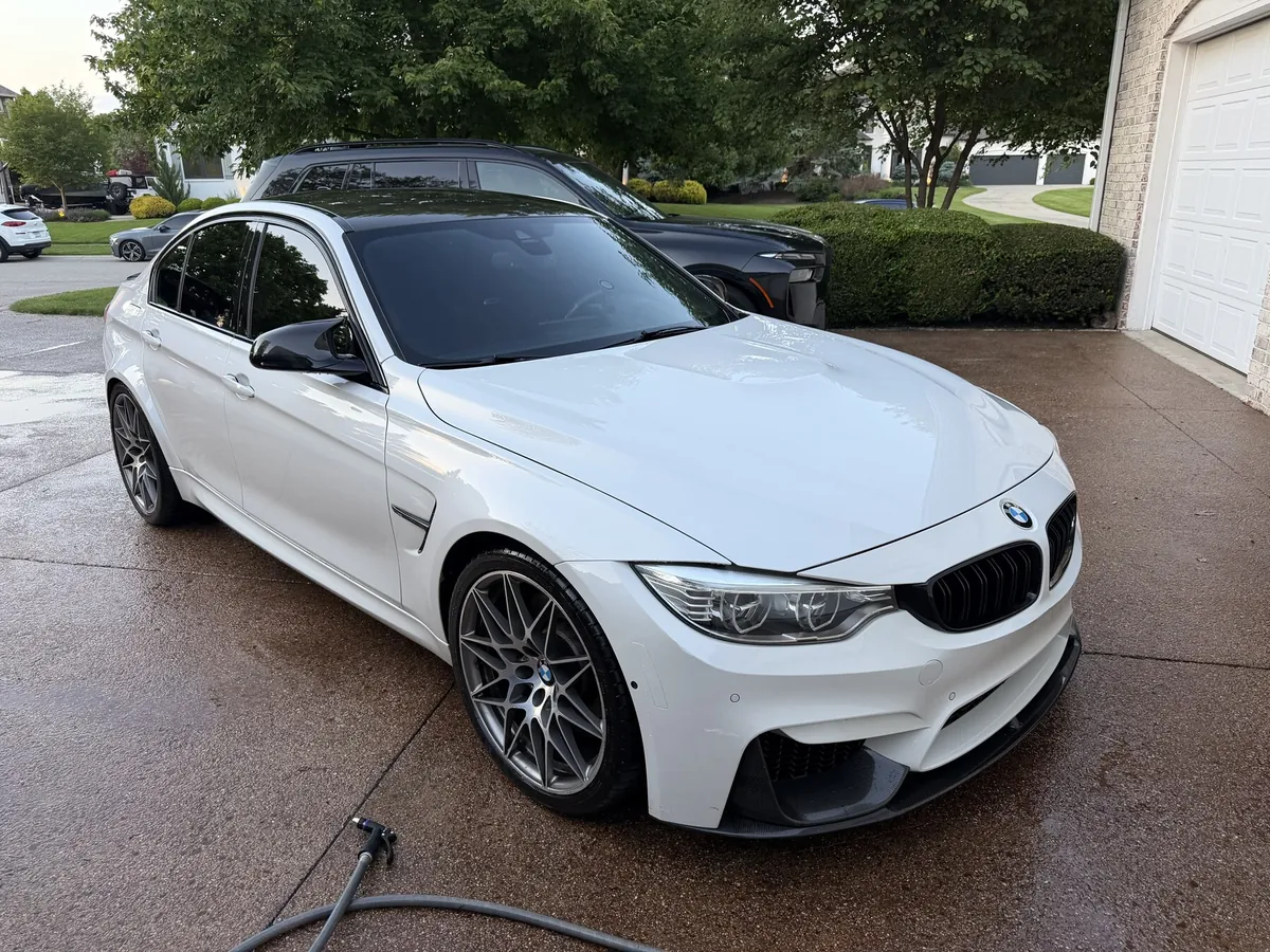 White BMW M3 Competition after a mobile exterior detail and wax