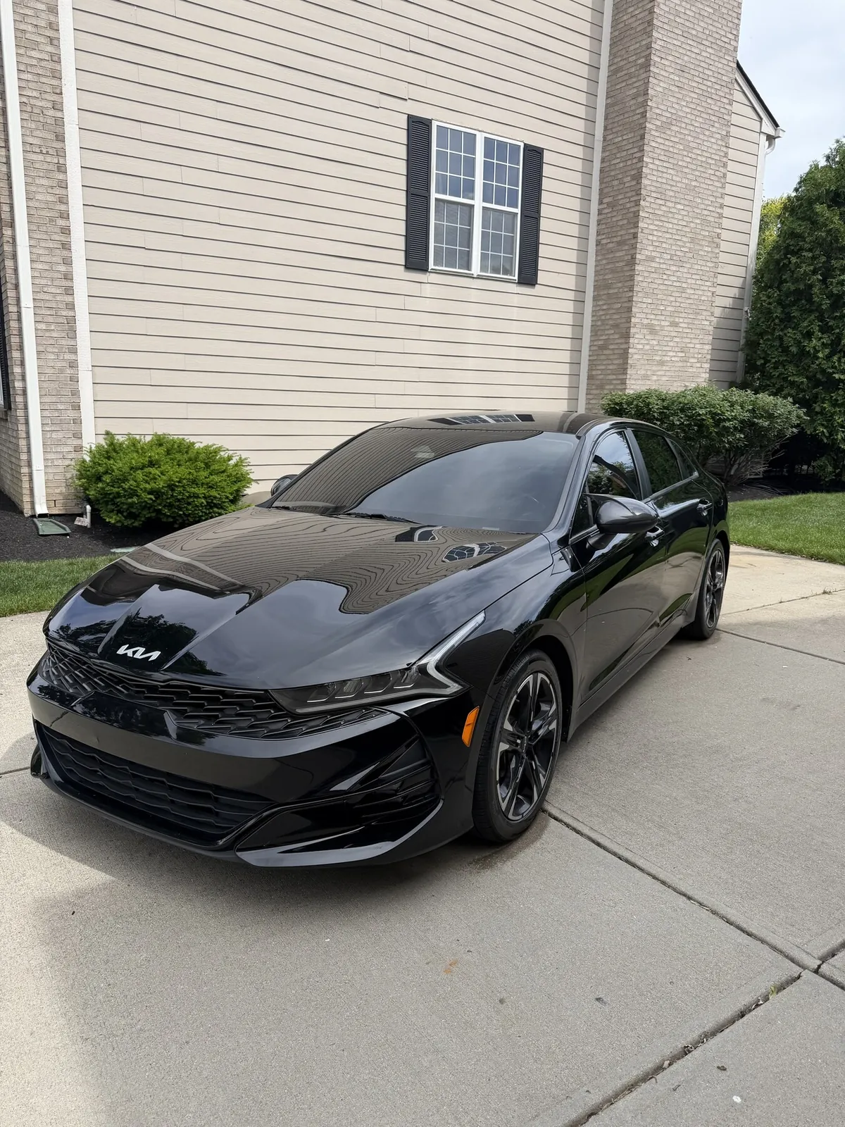 Black Kia K5 after a full mobile detail, wash and wax in Noblesville Indiana