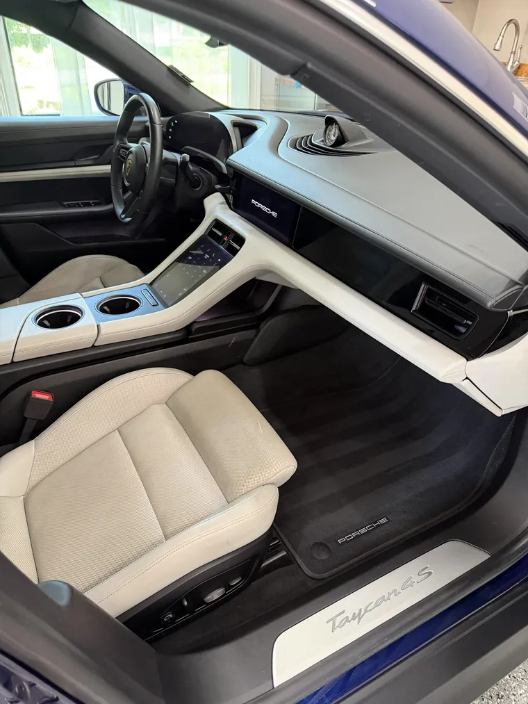 Porsche Taycan white leather dash and console after interior detailing